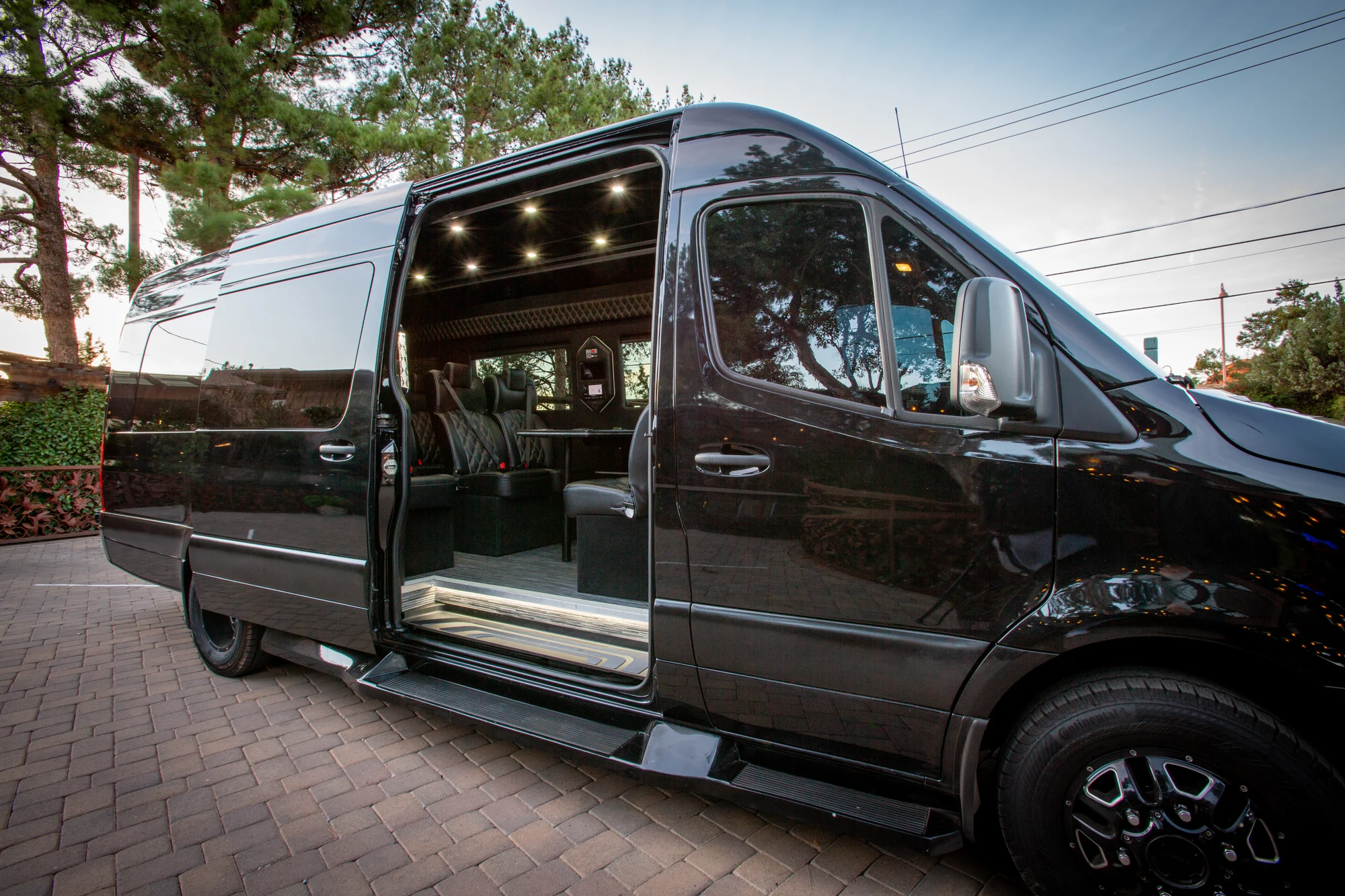 Executive Mercedes-Benz Sprinter with passenger door open